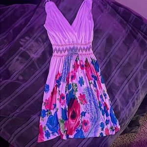 It’s a beautiful, white summer dress it goes to mid day one size fits most